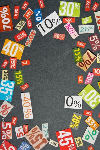 DISCOUNTS background is made up of multi-colored cut out figures