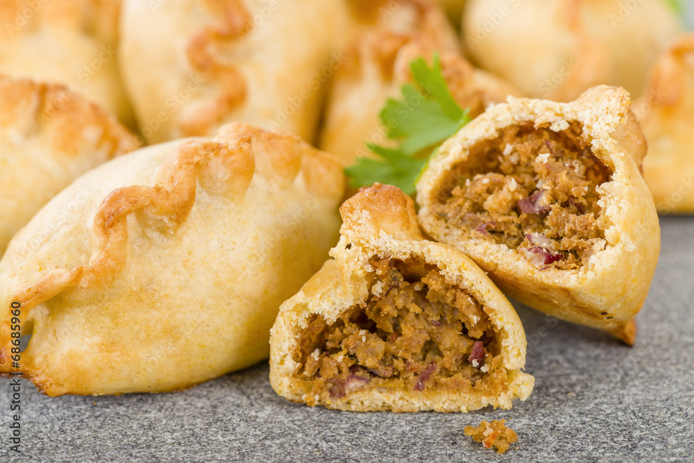 Ταπετσαρία Cornish Pasty - Baked pasty filled with meat and potatoes.