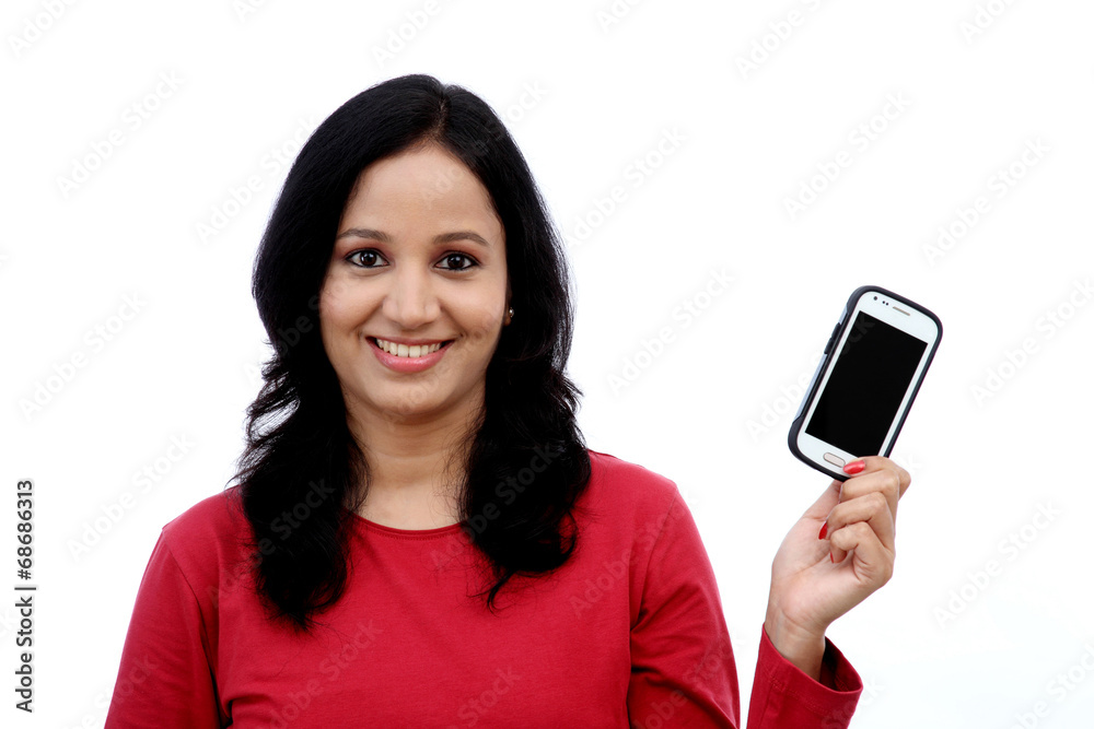 Young woman holding mobile phone Young woman holding mobile phone