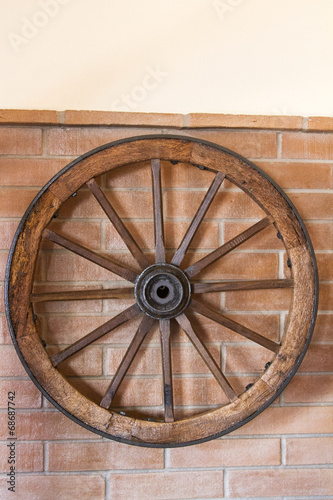  Antique Cart Wheel hanging on a wall. © Mauro Rodrigues
