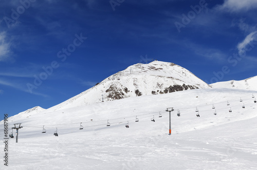Panorama of ski resort at sunny winter day