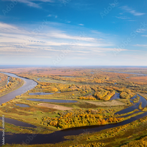 Top view of the flood-land of river in autumn