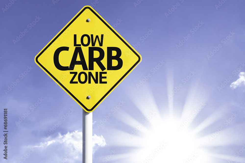 Low Carb Zone road sign with sun background Low Carb Zone road sign with sun background