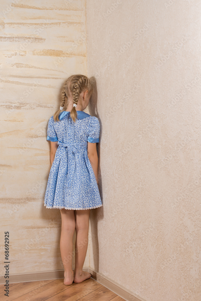 Little girl being punished standing in the corner Stock Photo Adobe Stock