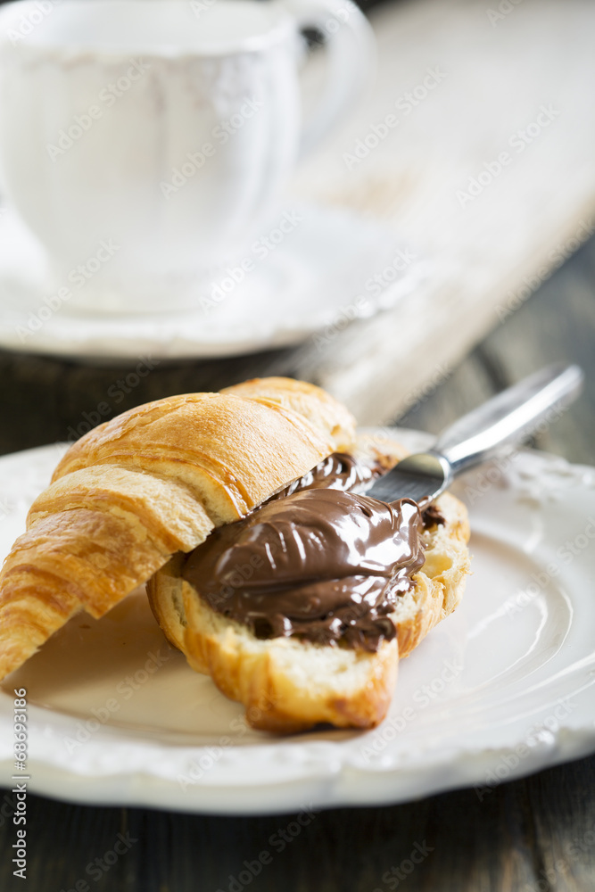 Croissant with chocolate for breakfast. Croissant with chocolate for breakfast.