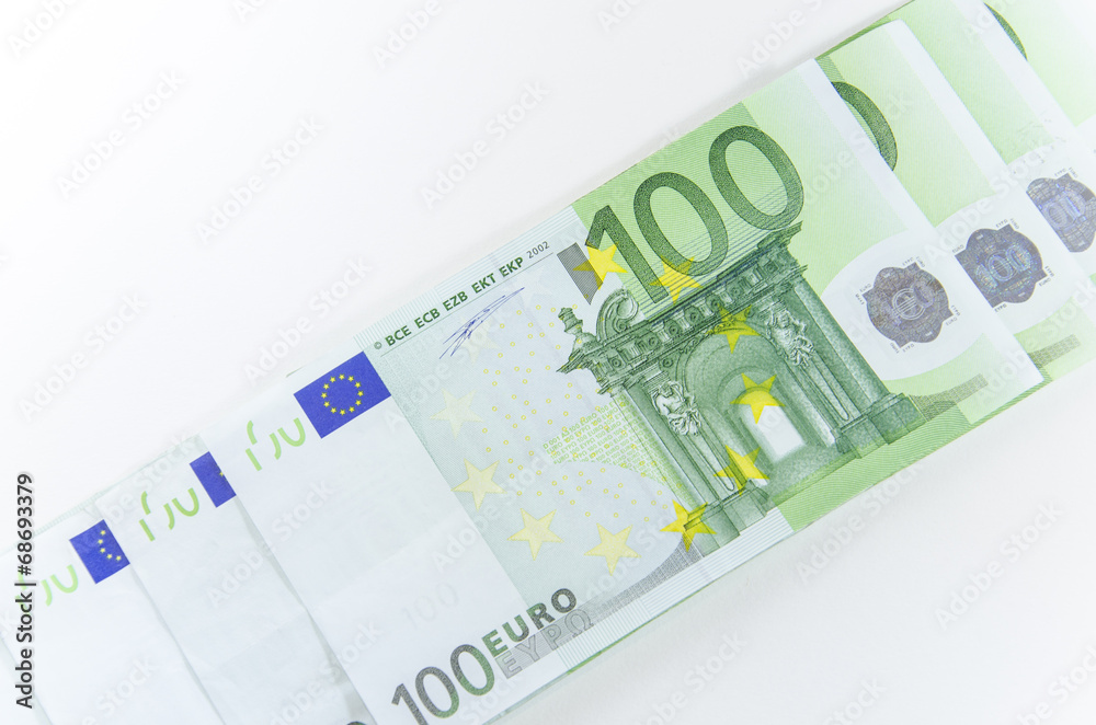 Close-up of 100 Euro banknotes isolated on white background. Close-up of 100 Euro banknotes isolated on white background.