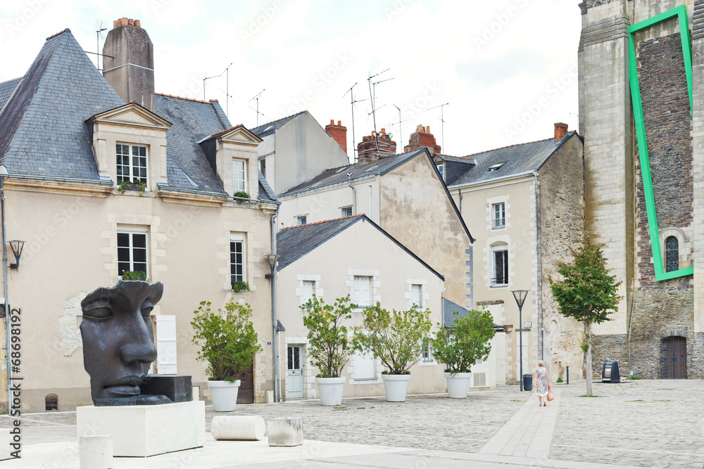 statue on Rue du Musee street in Anges, France