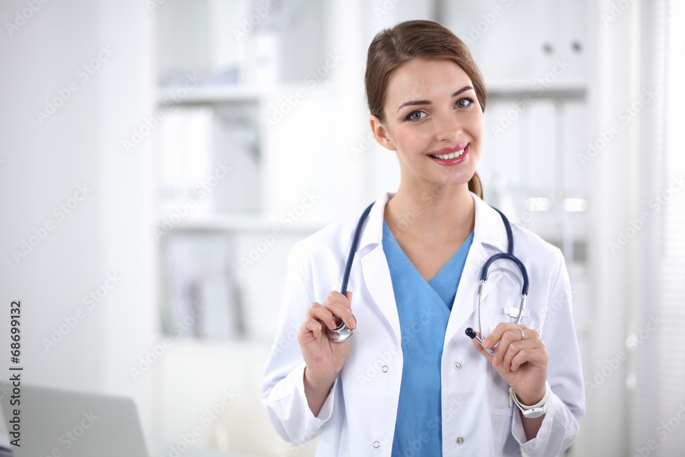 Portrait of happy successful young female doctor holding a Portrait of happy successful young female doctor holding a