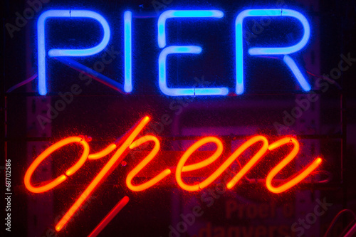 A blue and red Pier Open sign © piccaya