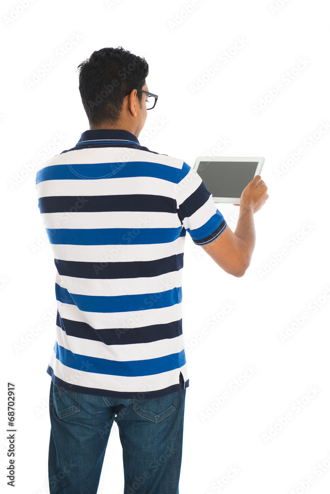 indian casual male with a tablet on white background indian casual male with a tablet on white background