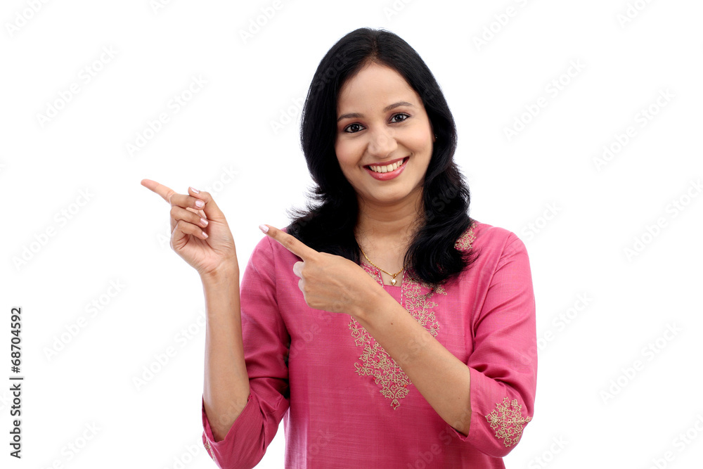 Smiling young woman showing isolated presentation Smiling young woman showing isolated presentation