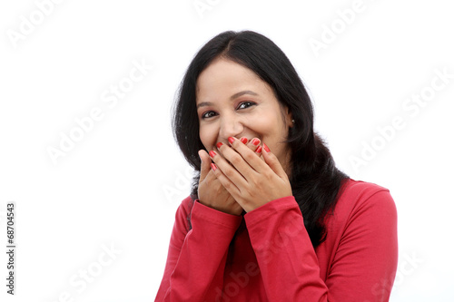 Young woman covering mouth with her hands