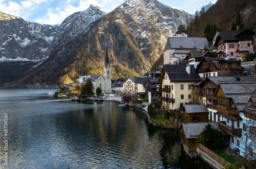 Village with iconic church  lake and mountain background