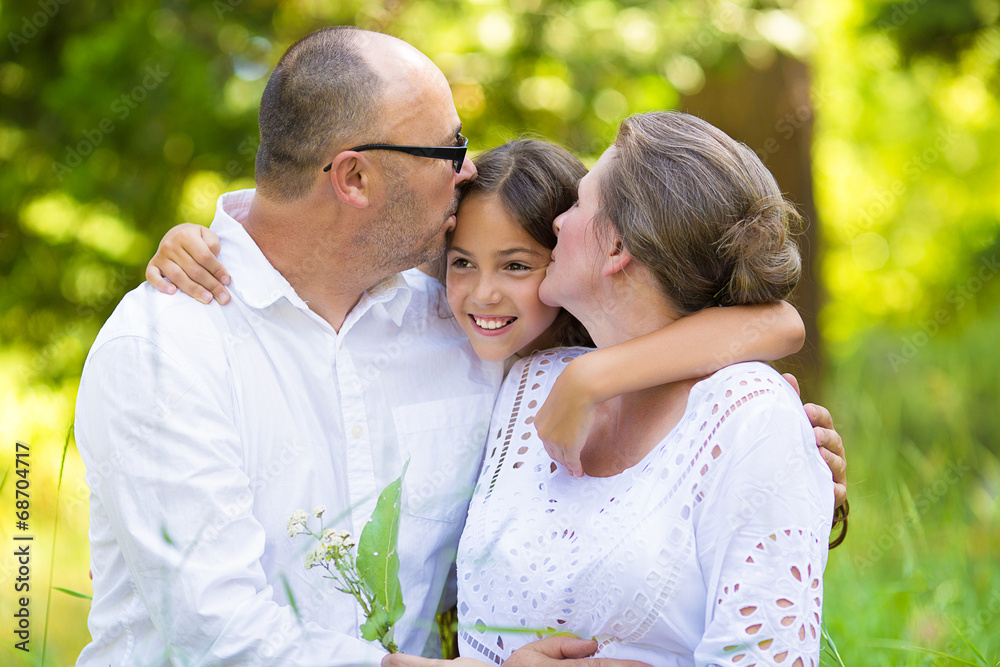 Portrait happy family outdoors together on a summer day Portrait happy family outdoors together on a summer day