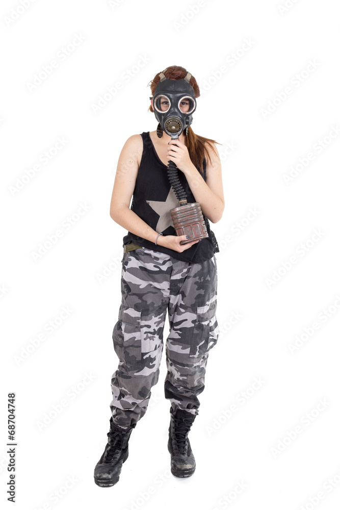 Military young woman wearing gas mask and uniform