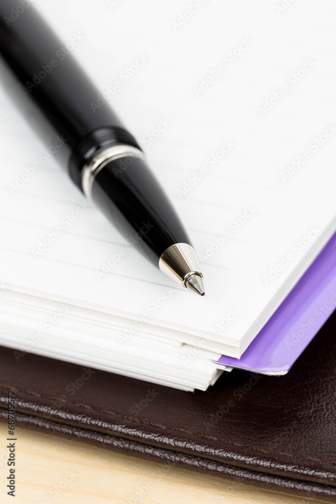 Pen on blank page organizer business concept Pen on blank page organizer business concept
