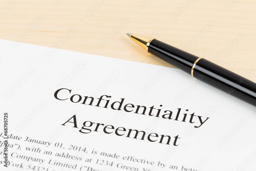 Confidentiality agreement document with pen close-up Confidentiality agreement document with pen close-up