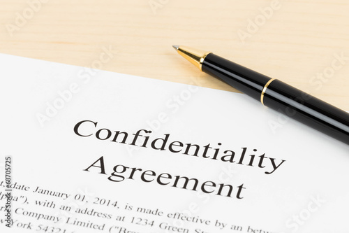Confidentiality agreement document with pen close-up