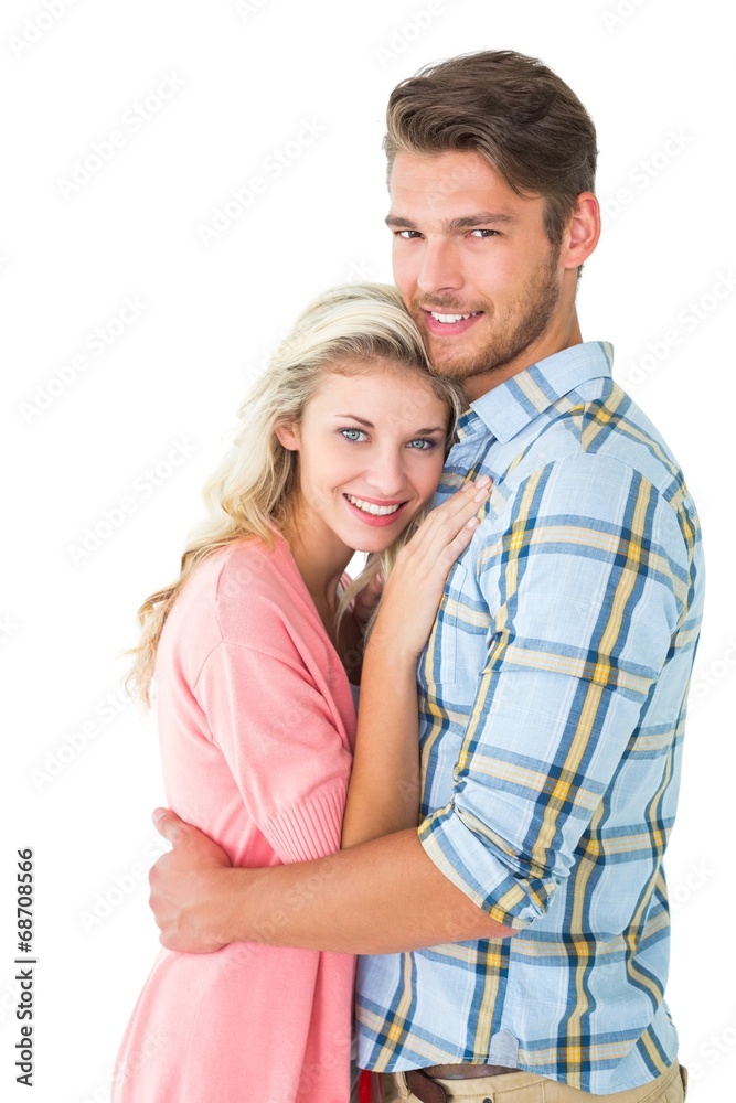 Attractive couple embracing and smiling at camera Attractive couple embracing and smiling at camera