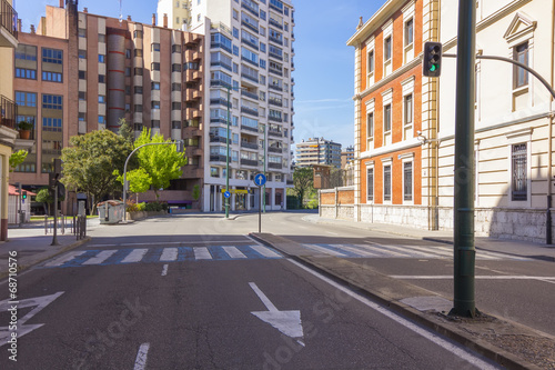 modern street with pedestrian crossing  traffic lights and paint