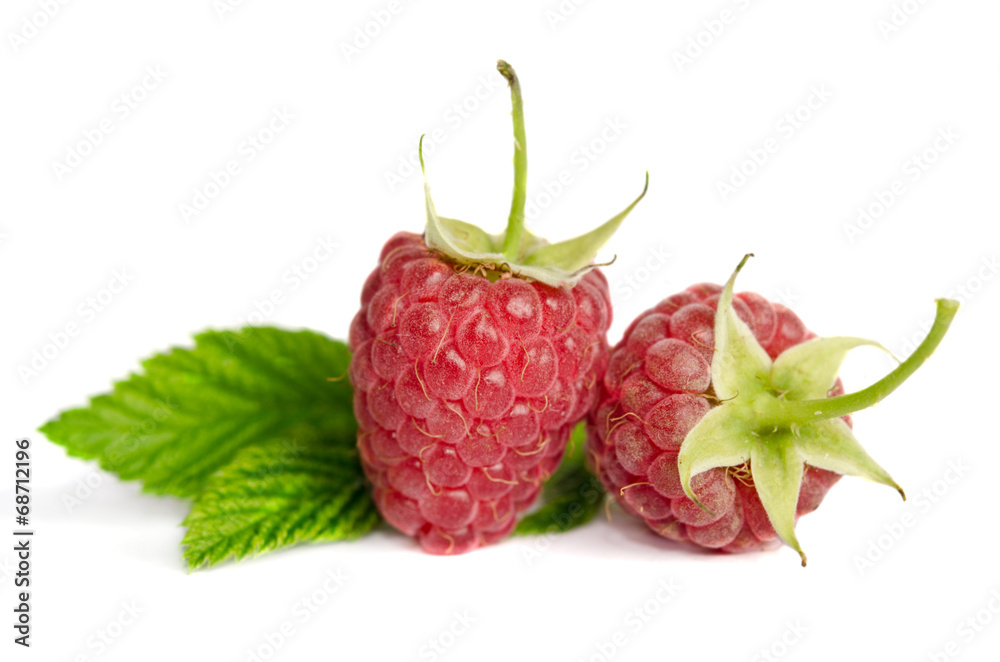 Two sweet ripe raspberries isolated on white background Two sweet ripe raspberries isolated on white background