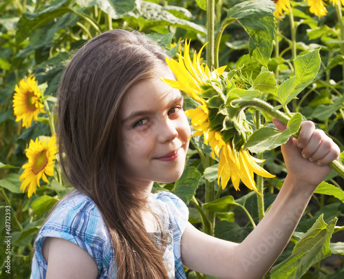 Beautiful child with sunflower