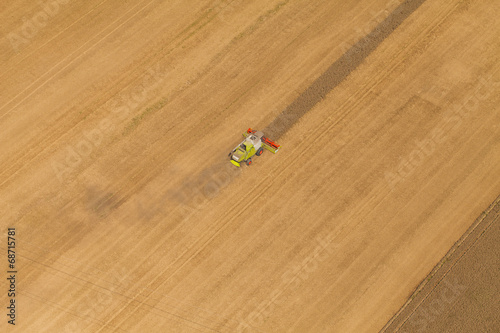 aerial view of combine on harvest field