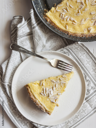 Cake with cream and pine nuts photo