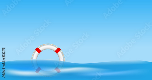 White life buoy floating on water