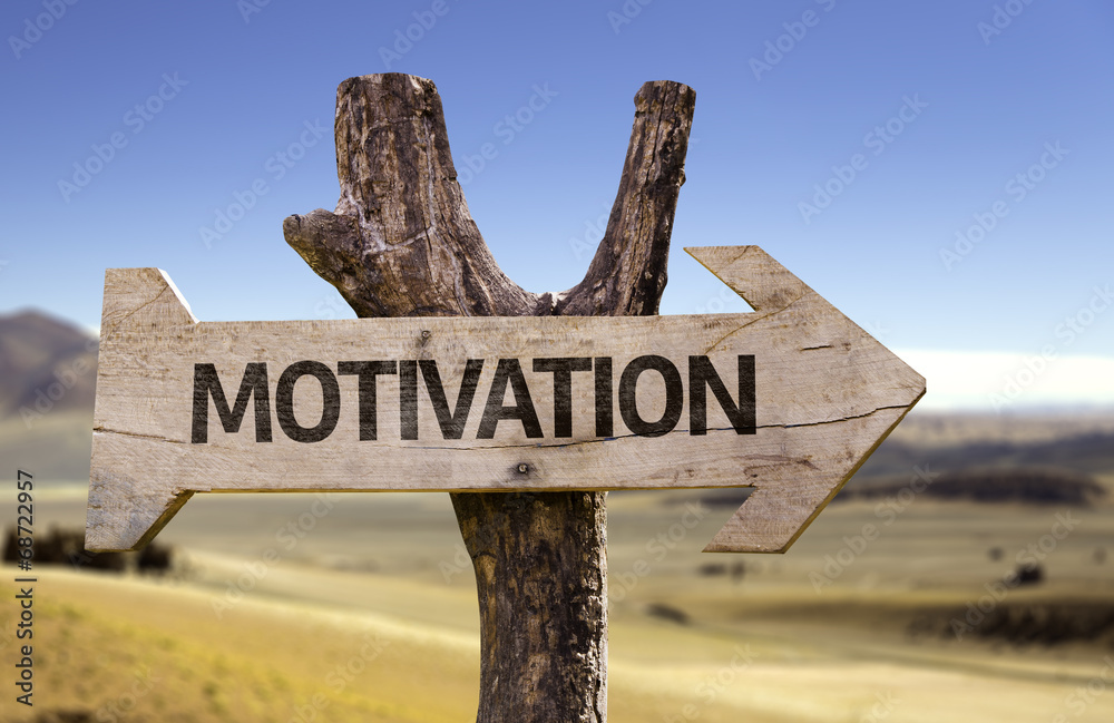 Motivation wooden sign with a desert background