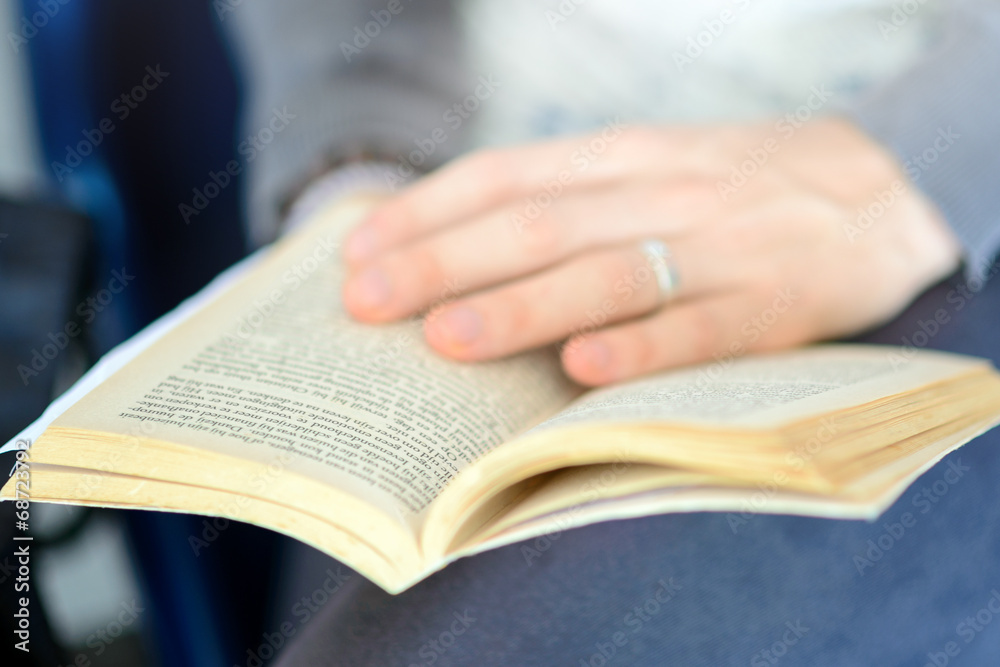 Closeup hand open book for reading Closeup hand open book for reading