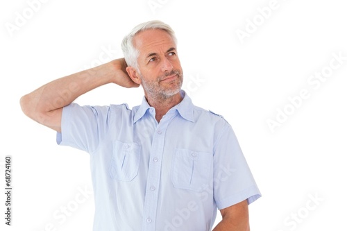 Thinking man posing with hand behind head
