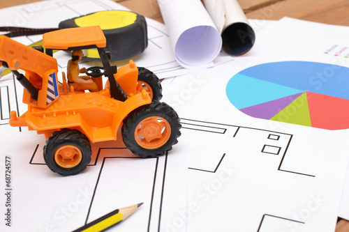 tractor toy on architect blueprints