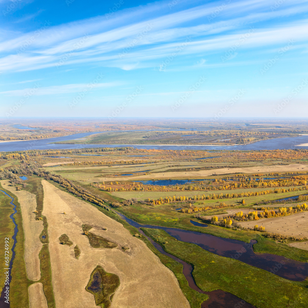 Top view of the countryside next to the river flood-land