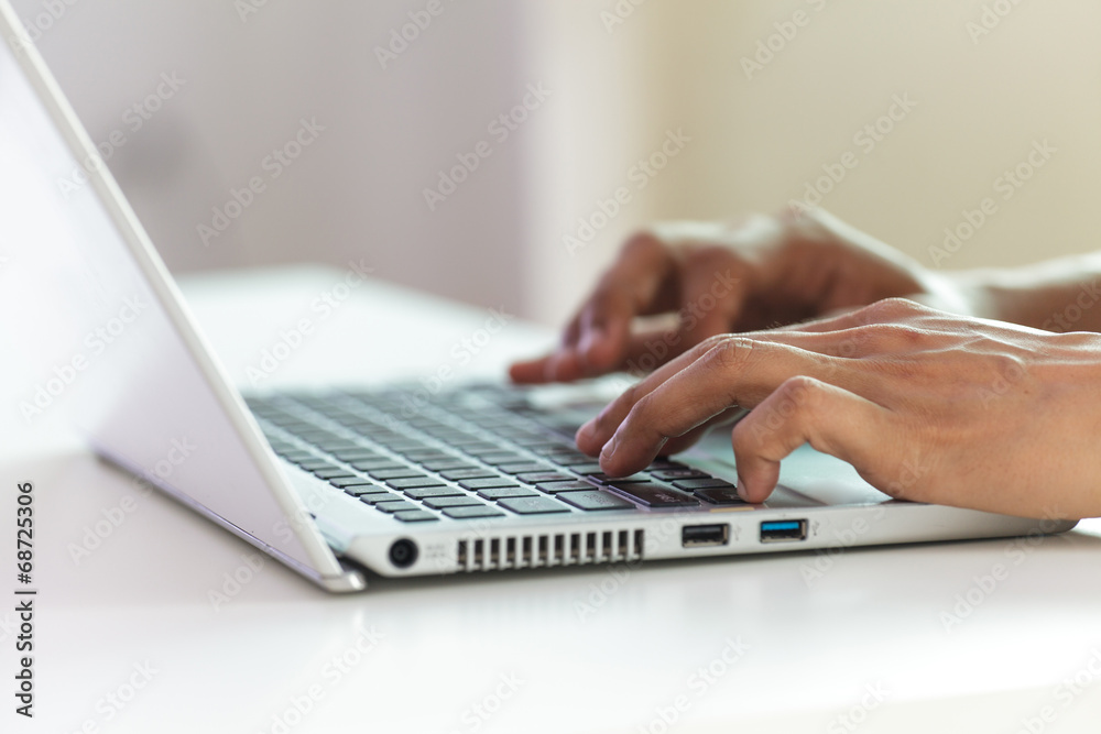 hands typing on laptop keyboard hands typing on laptop keyboard