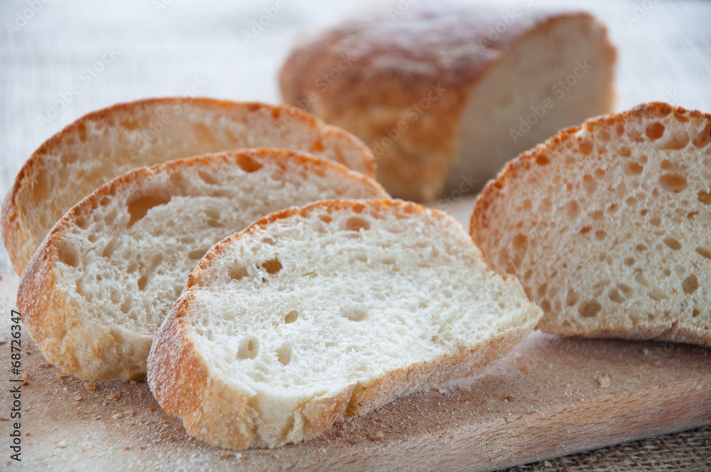 Sliced ciabatta on the board Sliced ciabatta on the board