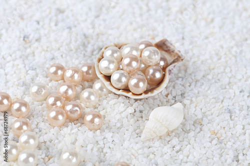 pearls in the sea shell on the sand
