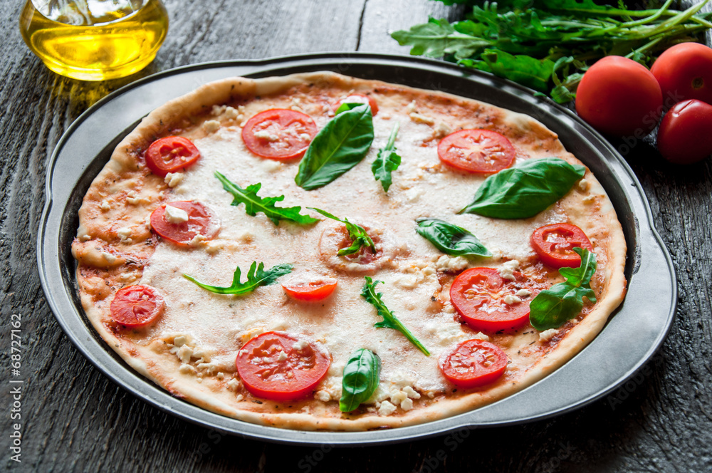 rustic italian pizza with mozzarella, cheese and basil