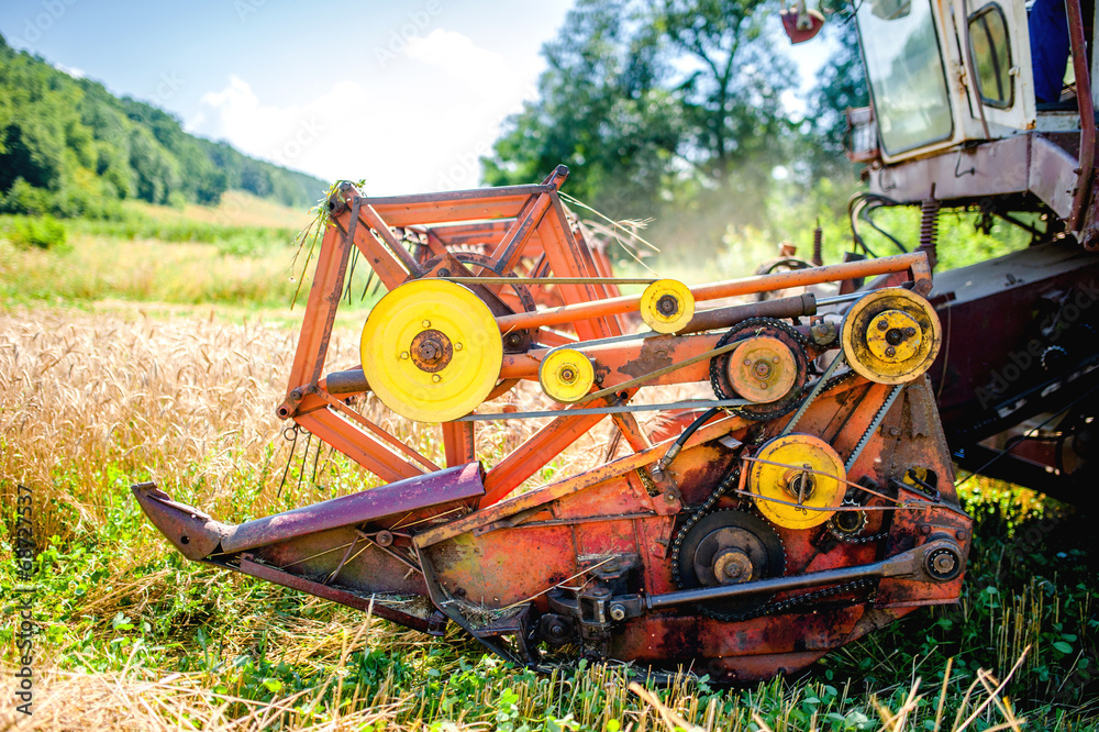 Fototapeta premium Detail of harvester machinery, tractor at farm with combine