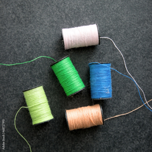 several spools of colorful thread