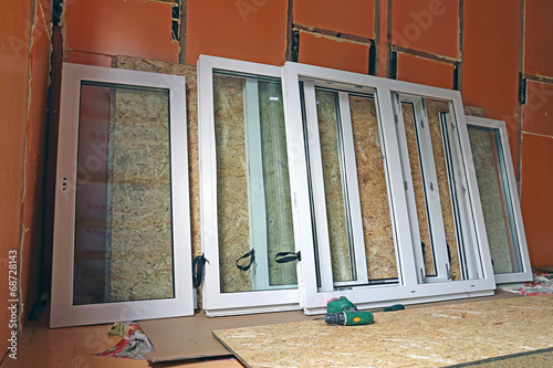 Installation of plastic windows in the frame house