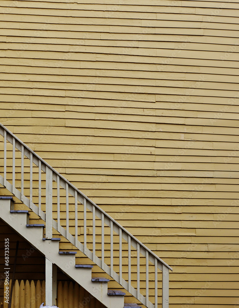 Fototapeta premium Yellow Wall with Stairs