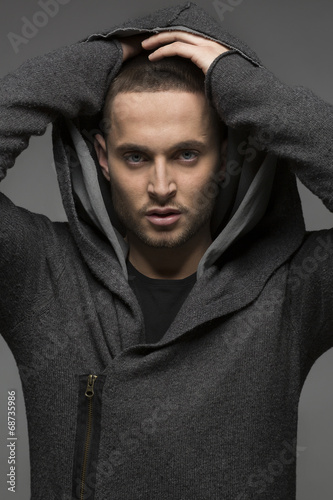 Handsome young man in a hood
