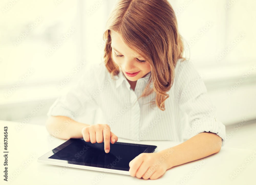 smiling little girl with tablet pc at school smiling little girl with tablet pc at school