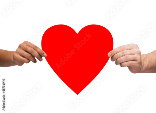 couple hands holding red heart