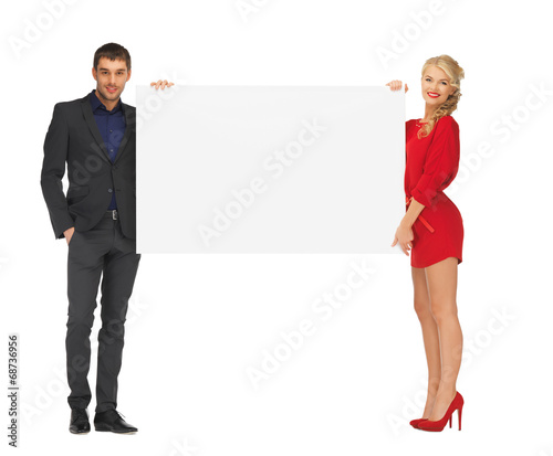 couple holding big blank white board