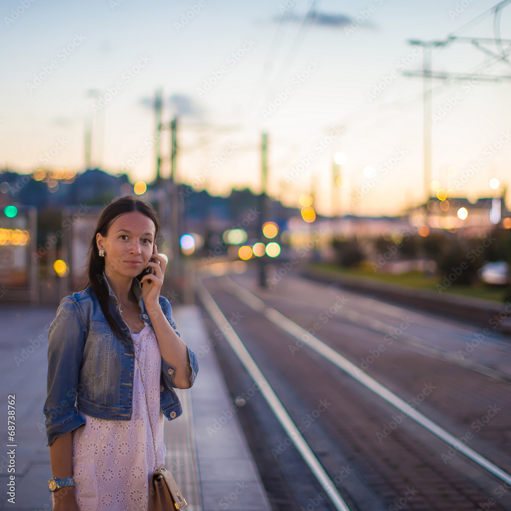 Young beautiful woman talking on her phone Young beautiful woman talking on her phone