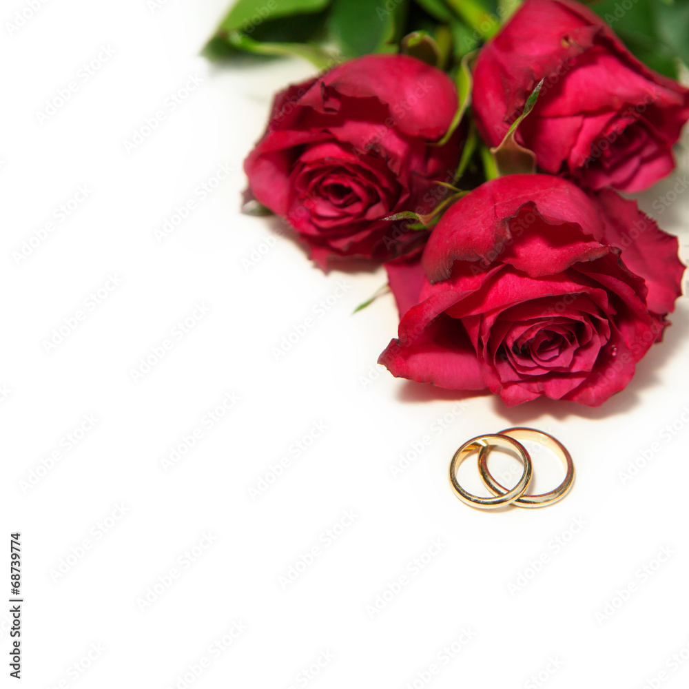 golden wedding rings and red roses.. golden wedding rings and red roses..