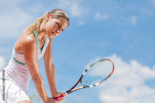 Young woman playing tennis © BGStock72
