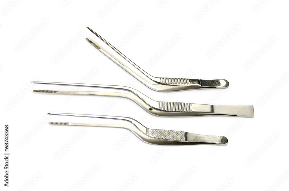 steel surgical instruments on a white background steel surgical instruments on a white background